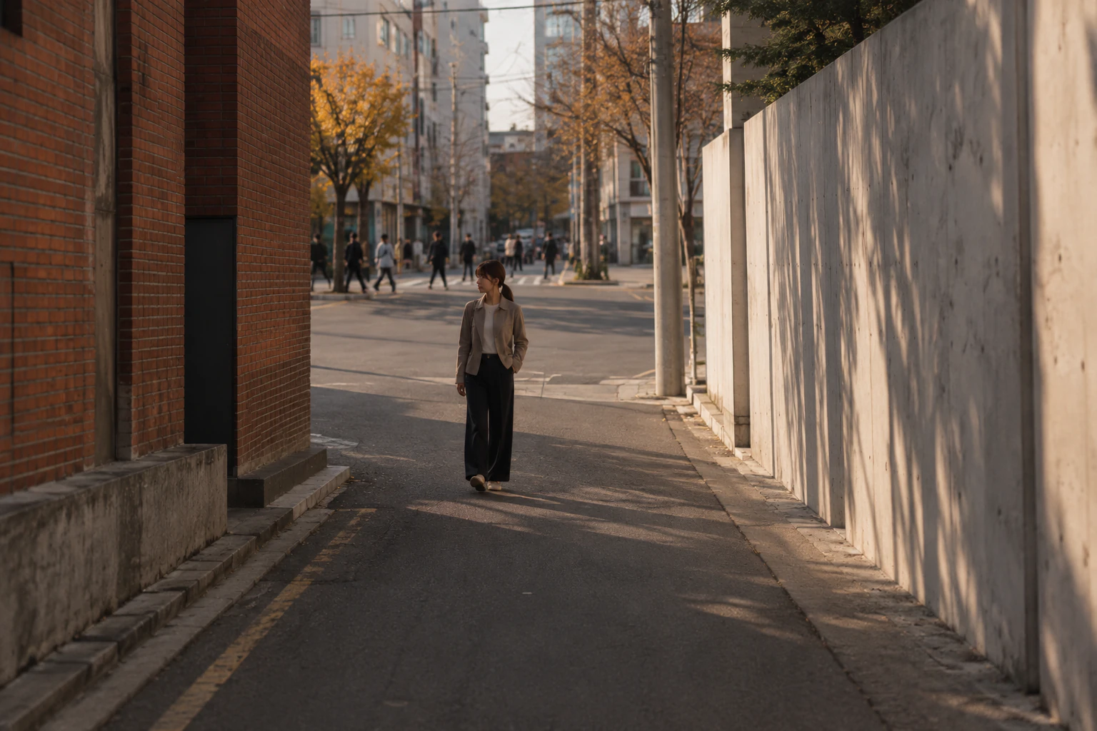 Stepping off the busier street into a quiet side alley in late afternoon