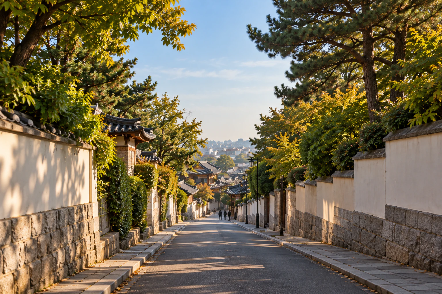 A lane descending between walls and trees, distant figures. Editorial image.