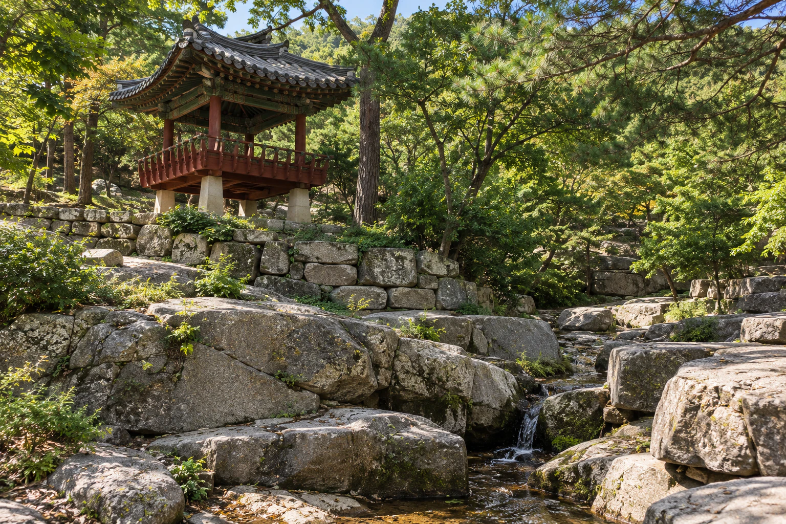 A square pavilion with red posts among pines, above walls of stacked stone. No people. No lettering. Editorial image.